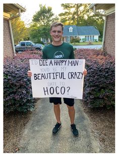 a young man holding a sign that says, i'd die a happy man if you be my beautiful crazy father to ho