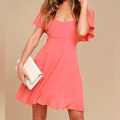 This Coral Pink Skater Dress Is Always Ready For Any Special Occasion That Comes Its Way! Lightweight Woven Fabric Forms Fluttering, Elasticized Sleeves Atop A Darted Bodice, Fitted Waist, And Flaring Skater Skirt. Tying Back, Plus Hidden Back Zipper. Lined. 100% Viscose. Hand Wash Cold Pink Flowy A-line Mini Dress, Solid Color Flutter Sleeve Dress For Brunch, Feminine Flowy Solid Mini Dress, Feminine Flutter Sleeve Dress, Pink Flutter Sleeve Mini Dress For Party, Casual Party Dress With Flutter Sleeves, Pink Flutter Sleeve Mini Dress For Summer, Pink Flutter Sleeve Mini Dress For Day Out, Pink Mini Dress With Flutter Sleeves For Spring