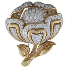 A blooming flower brooch, complete with petals, stem and leaves. This cute estate brooch features 2.18 carats of colorless round brilliant cut diamonds pave set in an 18K rose gold. Brooch Length: 1.5 inches Brooch Width: 1.25 inches Diamond Flower Brooch, Gold Brooch, Brooch Bouquets, Antique Brooches, Diamond Brooch, Gold Brooches, Diamond Flower, Antique Diamond, Diamond Gold