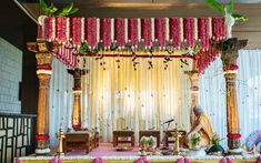 a decorated stage with flowers and candles