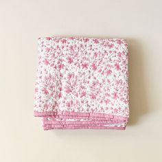 a pink and white floral print sheet set