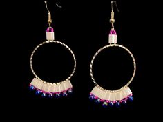 These white and blue silver hoop earrings are accented with pink small beads. White Metal Jewelry With Colorful Beads, White Metal Hoop Jewelry, Nickel-free Pink Beaded Hoop Earrings, Pink Hoop Metal Jewelry, White Metal Beaded Earrings With Ear Wire, White Dangling Hoop Earrings With Colorful Beads, White Dangle Hoop Earrings With Colorful Beads, White Metal Beaded Earrings, White Small Hoop Beaded Earrings Nickel Free