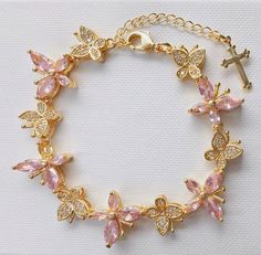 This beautiful butterfly bracelet with a cross at the end adds to your fashion and faith. It is 14k gold plated. Length is 18cm and can be adjustable. Butterfly Jewelry Aesthetic, 2025 Rebrand, Bracelet With Cross, Bracelet Butterfly, Christian Bracelets, Cute Clothing Stores, Butterfly Bracelet, Pink Girly Things