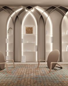 an empty room with chairs and bookshelves on the walls is lit by lights