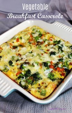 vegetable breakfast casserole with cheese and broccoli in a white baking dish