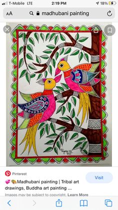 two colorful birds sitting on top of a tree