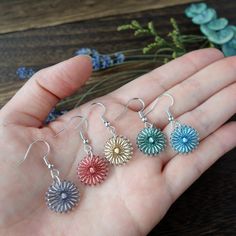 "▷Fingertip-sized flower earrings Earrings made of silk thread with the image of small flowers that bloom casually on the roadside, such as chrysanthemums and marguerites. ▷5 colors variation - yellow - red - blue - green - violet ▶FEATURES: - Lightweight with only 0.5g of total - Hypoallergenic - Comfortable to wear - Japanese silk thread ▶SIZE: - total length: 20 mm - width: 15 mm - thickness: 2 mm - weight: 0.5 g ▷Beautiful simple color scheme Two colors of silk thread are used. The colors complement each other and harmonize gently. ▷With deep colors and monotone color fashion Earrings in calm colors go great with deep colors that are popular in autumn and winter. Deep red and mustard yellow, and monotone colors such as black and gray. It looks kawaii with a simple turtleneck sweater. ▷ Silk Thread Earrings Designs, Winter Deep, Calm Colors, Silk Thread Earrings, Silk Thread Jewelry, Thread Jewellery, Thread Earrings, Japanese Silk, Color Complement