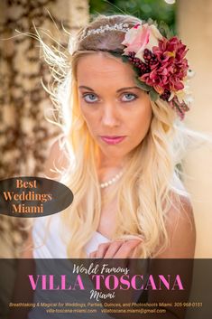 a woman with long blonde hair and flowers in her hair is posing for the camera