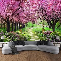 an image of a beautiful garden with pink flowers on the trees and path leading to it