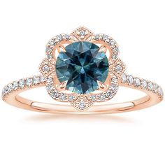 a blue sapphire and diamond ring in rose gold