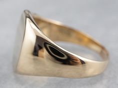 This signet ring is simple in design and will never go out of style! Sleek and unadorned, this ring has a nice heft to it in 14 karat yellow gold. A unisex design makes this piece versatile and appealing to many different tastes! Market Square Jewelers works with one of the finest hand engravers in the northeast. With over 30 years of experience, our engraver hand carves lettering, monograms, crests, or patterns in period-specific styles. Choose from our many monogram options shown in the listin Modern Luxury Signet Ring With Polished Edges, Luxury Hammered Yellow Gold Signet Ring, Luxury Modern Signet Ring With Polished Edges, Luxury Brass Signet Ring In Minimalist Style, Luxury Modern Signet Ring For Formal Occasions, Luxury Refined Signet Ring With Polished Finish, Luxury Modernist Signet Ring As A Gift, Luxury Yellow Gold Modernist Signet Ring, Luxury Modernist Signet Ring As Gift