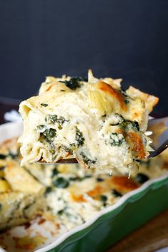 a spoon full of spinach and cheese casserole