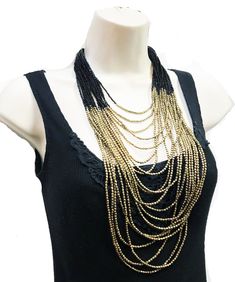 "beautiful long boho Beaded necklace, perfect for the upcoming holiday parties, beach parties etc. ** Long and Layering Necklace ** hand beaded jewelry ** Length of Necklace is 38 inches ** Perfect on a Little Black Dress or even a T-shirt. ** Make a statement with this stunning piece at the party! This beautiful necklace would make a great Gift for someone special. All Items come carefully wrapped in our branded boxes or bags. A complimentary message can be included on request. PRESS: \" TANEES Bohemian Black Beaded Necklaces For Summer, Bohemian Black Beads Jewelry, Bohemian Beaded Layered Necklace For Party, Bohemian Long Bib Necklaces For Party, Bohemian Long Bib Necklace For Parties, Black Dangling Beads Jewelry For Beach, Bohemian Summer Necklace With Black Beads, Bohemian Black Beads Necklace For Summer, Black Beach Jewelry With Dangling Beads