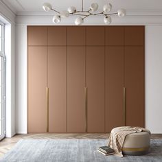 a living room with brown cabinets and a white rug on the floor in front of it