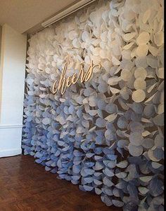 the wall is decorated with paper flowers