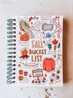 a notebook with the words fall bucket list written on it