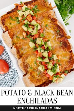 an enchiladas dish with tomatoes and avocado on top