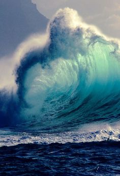 a large wave is breaking in the ocean