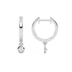 Small gold hoop earrings featuring a dangling 0.10 CT diamond on each hoop, securely set in a bezel setting.Details: - Made to Order- Diamond Weight: 0.20 CT - No of Diamonds: 2- Diamond Type: Lab Grown Diamond (CVD, HPHT)- Diamond Cut: Round- Diamond Clarity: VS - Diamond Color: Colorless (DEF)- Setting Type: Bezel- Metal Type: 14K Solid Gold,18K Solid Gold- Choice of Gold Color: Yellow Gold, White Gold, Rose Gold- Jewelry Certification: Jewelry priced above $500 includes Third Party Lab Certif White Gold Huggie Earrings With Bezel Setting, Fine Jewelry Bezel-set Huggie Hoop Earrings, Elegant Bezel Set Huggie Hoop Earrings, Modern White Gold Hoop Earrings With Single Diamond, Anniversary White Gold Hoop Earrings With Single Diamond, White Gold Hoop Earrings With Single Diamond For Anniversary, Fine Jewelry Hoop Earrings With Bezel Setting For Anniversary, White Gold Hoop Earrings With Single Diamond, White Gold Dangle Hoop Earrings For Anniversary