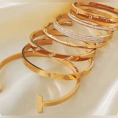 Embrace The Epitome Of Elegance With Our Bamboo Bangle And Diamond Bangles Collection. Crafted With Precision From High-Quality Stainless Steel, Each Bracelet Is Plated With Luxurious 18k Gold To Ensure A Non-Tarnish, Everlasting Shine. Designed For The Modern Woman, These Bracelets Exhibit A Geometric Pattern That Resonates With A Trendy And Punk Style, Accented By Micro-Insert Inlay Technology That Securely Holds Each Shimmering Luxury Plated Bangle As Gift, Timeless Gold Bangle With Diamond Accents, Gold Plated Bangle For Anniversary, Trendy Gold Jewelry With Diamond Accents, Trendy Yellow Gold Bangle For Formal Occasions, Trendy Gold Bracelets For Wedding, Trendy Gold Wedding Bracelets, Gold Plated Bangles, Waterproof Jewelry