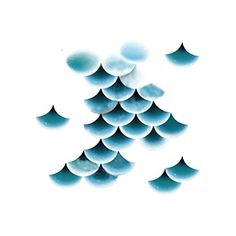 several drops of water floating on top of each other in front of a white background