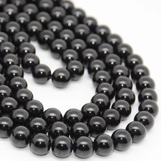 Note: There will be slight variation in Color and Look of the item (Since they are Naturally mined items) TYPE: Natural Polished Gemstone Bead Strand MATERIAL: Natural Black Spinel  BEADS SIZES:    8MM  The strand is approximately 39CM in length. The bead hole size is   0.7 - 0.9MM These gorgeous beads are perfect for designing/making your own jewelry. THANK YOU FOR SHOPPING AT BEADSTREASURECO! We pride ourselves on great customer service, high-quality supplies, and fast shipping to the USA. Here at BeadsTreasureCo, we dream big and love offering our customers the opportunity to do the same. If you ever have any questions, or concerns about your order, feel free to reach out to us at any time. Please be sure to read our shop policies regarding shipping times, and other information about yo Elegant 8mm Round Beads For Gems And Cabochons, Elegant 8mm Round Beads For Jewelry Making, Black Gemstone Round Beads, Black Round Gemstone Beads, Black Beaded Necklaces With 8mm Round Beads, Black Beaded Necklaces With 8mm Beads, Polished Round Beads For Jewelry Making, Round Polished Beads For Jewelry Making, Elegant Round Spacer Beads