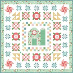 a quilt pattern with flowers and stars on the border, in pastel green tones