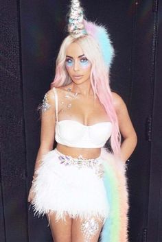 a woman in a white outfit with rainbow hair