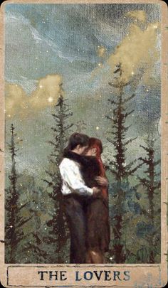 the lovers tarot card with two people hugging each other in front of some trees