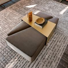 a coffee table with two trays on top of it in the middle of a living room