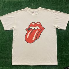 Vintage 90s Rolling Stones Lips Single Stitch Rock Band Tee Size: L Chest: 21" Length: 26" White Short Sleeve Crewneck T-Shirt By Anvil With Red Rolling Stones Hot Lips Tongue Logo Graphic And 1997 Bridges To Babylon World Tour Plane Globe Back Hit. Made In Usa. Single Stitch. Boxy Fit. Essential 1990s Rock Band Tee. Free Shipping On Bundles. Feel Free To Send An Offer. Preowned Clothing May Have Flaws. Please View All Pictures And Ask Any Questions Prior To Purchase. All Sales Are Final. Returns Not Accepted. Check Out Our Other Listings To Bundle And Save! We Have Thousands Of Vintage Graphic Tees In All Sizes And Styles. Follow Us To Catch New Drops - Steals Posted Daily! Thanks For Rolling Stones Shirt, Vintage Graphic Tees, Grunge Skater, Rock Band Tees, Shirts Vintage, Graphic Tees Vintage, Hot Lips, Vintage Graphic, White Short