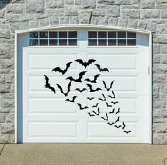 a garage door decorated with bats on it