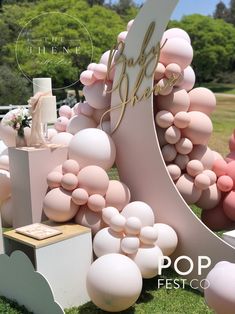 an outdoor event with balloons and decorations