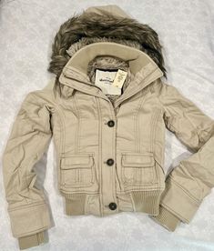 Item Description: Gorgeous and ultra luxurious, chic, and cozy faux fur lined jacket / coat with button and zip up front, pockets, long sleeves with attached fur lined and accented hoodie. Embroidered contrast moose at chest for authenticity. Perfect layering option for all her stylish looks. Shell: 100% Cotton / Lining: 80% Acrylic & 20% Polyester; Sleeve lining: 100% Polyester Girls = Sze SMALL Retail Value: $140.00 Thanks for looking and be sure to check our other store listings for additiona Chica Chola, Fur Lined Jacket, 00s Mode, Mcbling Fashion, Fur Jackets, Fits Clothes, Hoodie Coat, Swaggy Outfits