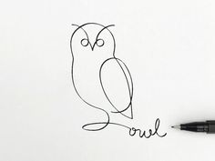 an owl drawn on paper with the word owl written in cursive writing next to it