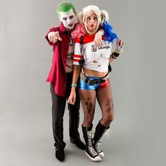 two people dressed up as the joker and harley in costume posing for a photo together