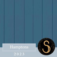 a blue wall with the letter s on it and a black sign that says hamptons