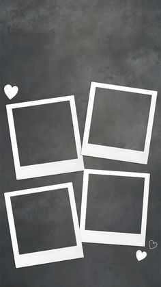 four white frames with hearts drawn on the side and one has been placed in front of them