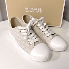 Michael Kors City Sneakers. The Iconic Michael Michael Kors Mk City Sneaker Is An Essential Closet Staple! This Low-Profile Sneaker Is Crafted With A Logo-Print Canvas Upper. Rounded-Toe Construction Is Designed With A Vulcanized Tow Cap, Lace-Up Closure, Soft Fabric Lining, And A Rubber Outsole. In Natural New With Box Beige Leather Sneakers With Logo, Beige Round Toe Sneakers With Logo, Spring Low-top Sneakers With Logo, Beige Lace-up Sneakers With Logo, Spring Logo Lace-up Sneakers, Spring Lace-up Sneakers With Logo, Cream Lace-up Sneakers With Logo, Flat Canvas Sneakers With Cushioned Footbed, Cream Flat Sneakers With Textured Sole