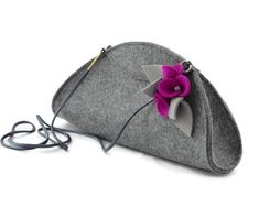 a gray purse with a pink flower on it