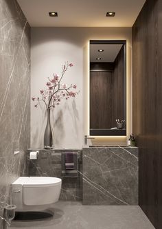 a modern bathroom with marble walls and flooring