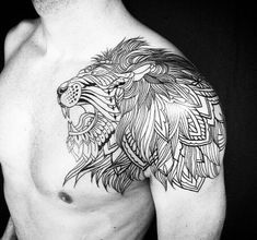 a man with a lion tattoo on his chest