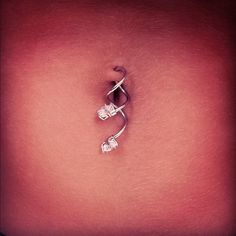 a woman's belly with an upside down ring