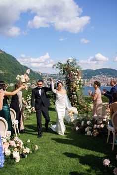 a bride and groom walking down the aisle after their wedding ceremony at villa venezza