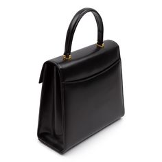 Juliet Handbag in Black/Black A much larger version Launer’s most famous Traviata design. The leather used to make these soft leather handbags is imported from Italy and only butter-soft, unblemished hides are selected. Every piece has perfectly rounded corners and smooth, turned-edging—a hallmark of the highest quality leatherwork. Just as elegant as the exterior, the interior is fully lined in Italian suede. Craftsmanship is paramount. Every piece of leather is hand-cut, every seam handsewn, a Launer London, Soft Leather Handbags, Handbag Heaven, Black Handbags, Black Interior, Leather Working, Rounded Corners, Soft Leather, Leather Handbags