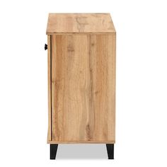 a wooden cabinet with black legs and an open door on the front, against a white background