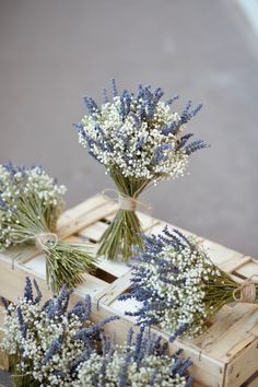 lavenders are tied to wooden crates with twine