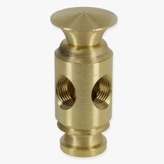 an brass plated metal knob with two holes on the front and back side,