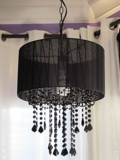 a black chandelier hanging from the ceiling