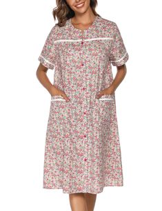 a woman wearing a white and pink floral print nightgown with pockets on the side